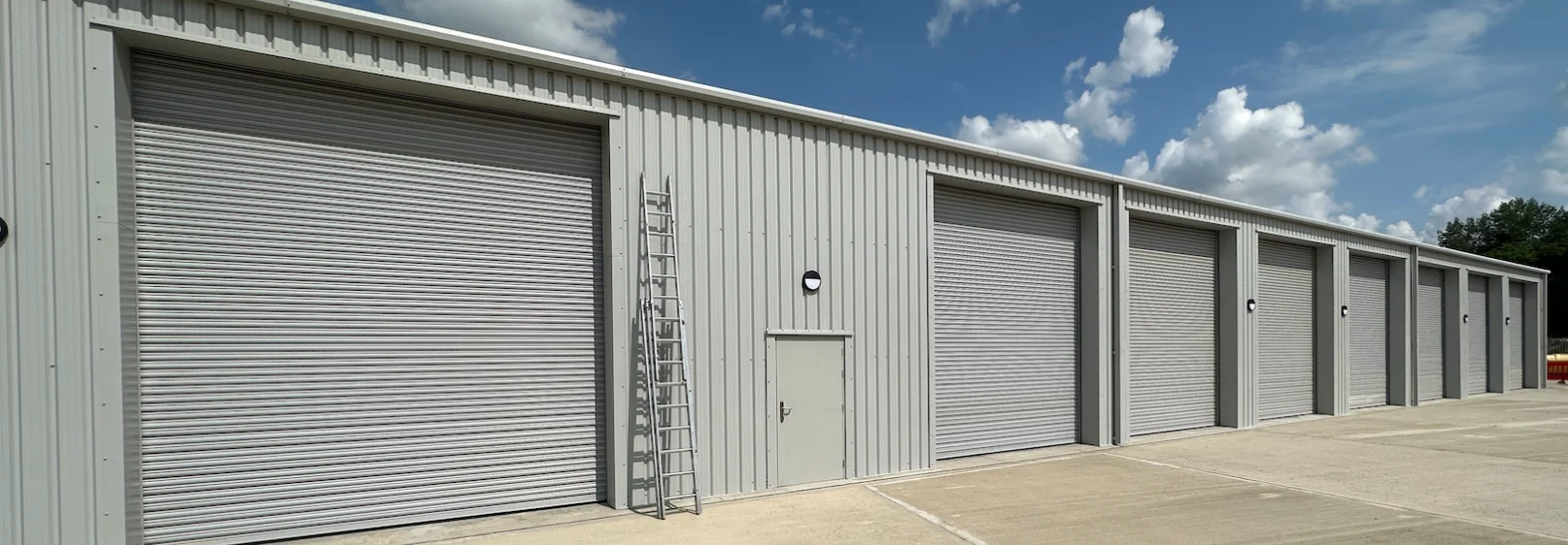 Row of eight roller shutters on a commercial property in Nottingham
